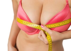 Woman measuring her bust